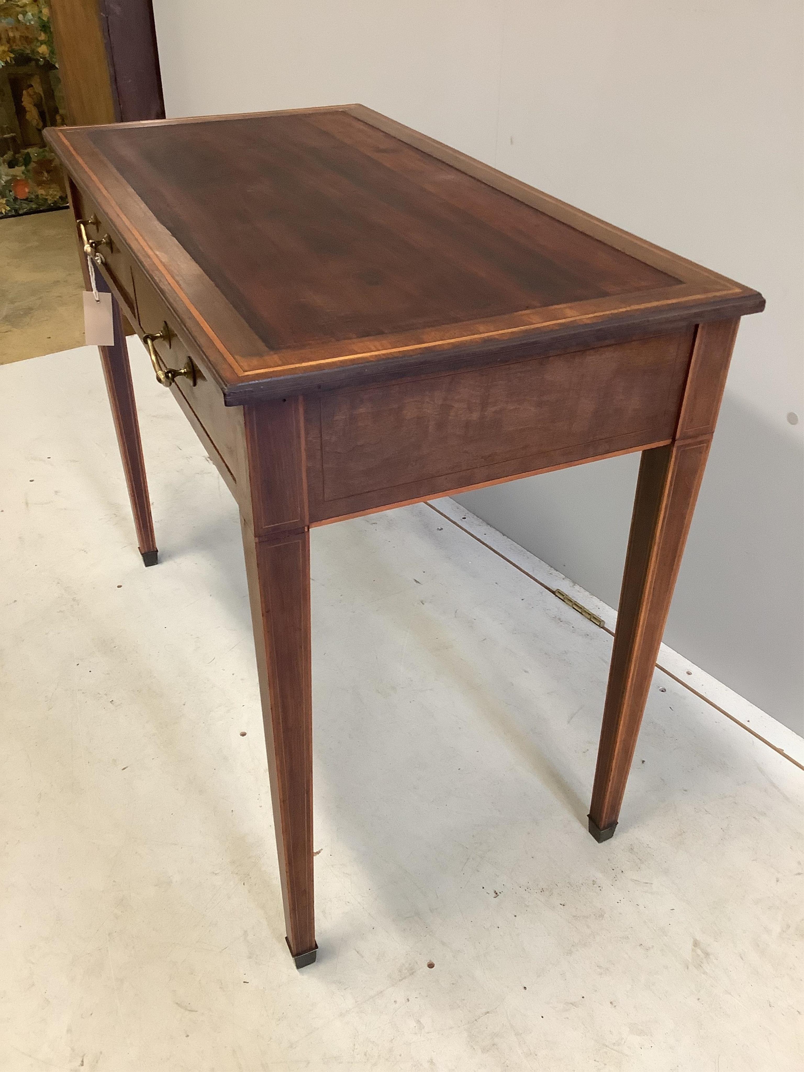 An Edwardian Edwards and Roberts satinwood banded mahogany writing table, width 91cm, depth 47cm, height 72cm. Condition - fair, lacks leather top